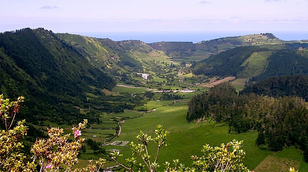 Panoramic view down the crater valley toward farmland, forest and the Atlantic coastline