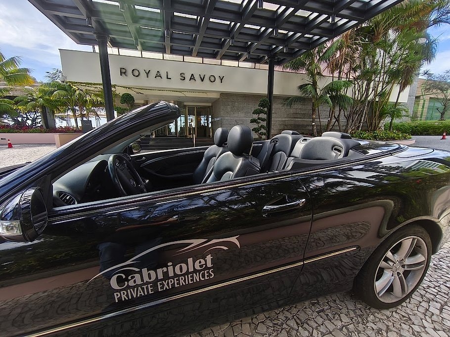 Cabriolet convertible parked under the entrance of the Royal Savoy hotel in Madeira.